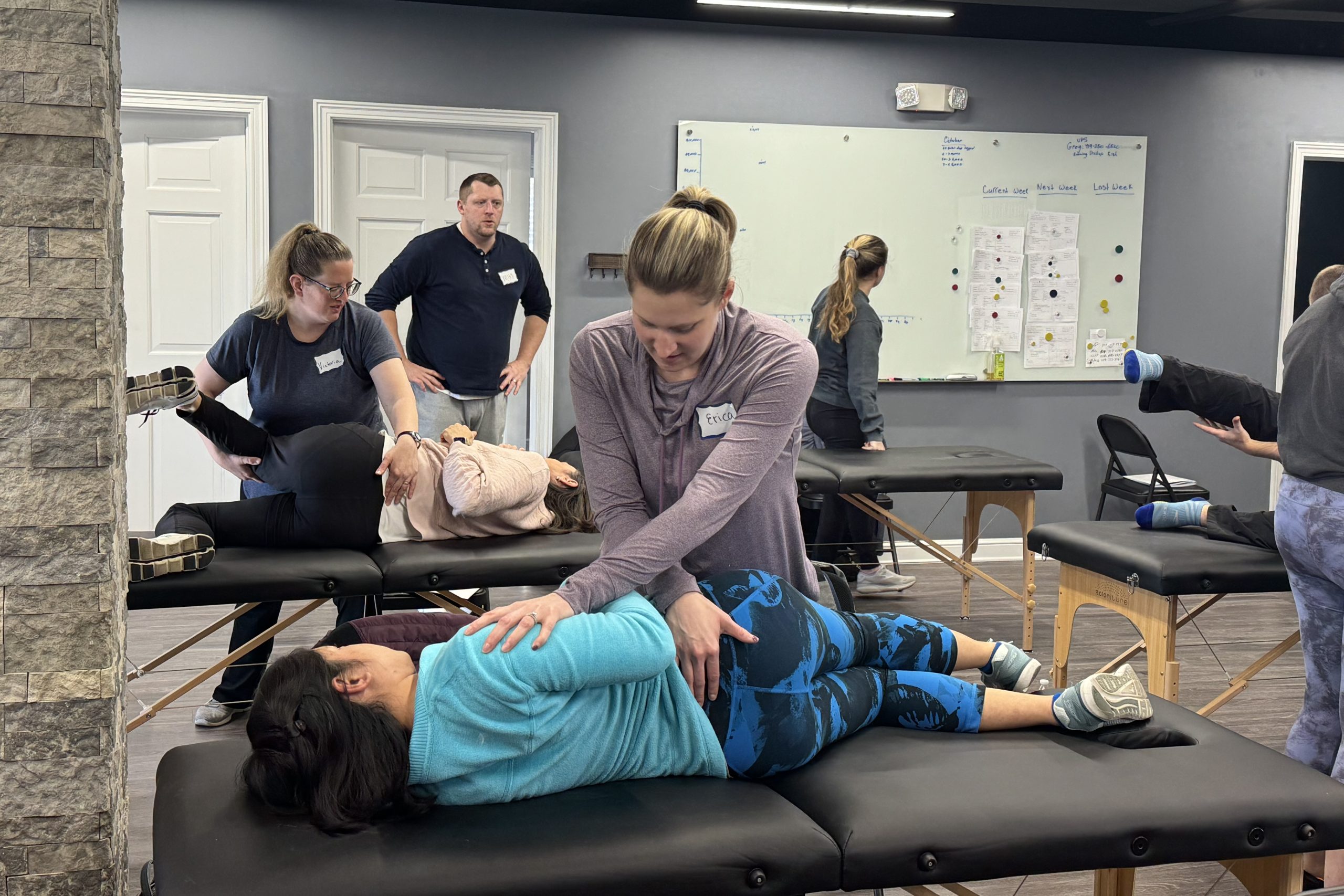physical therapist practicing new technique at sacroiliac CEU course