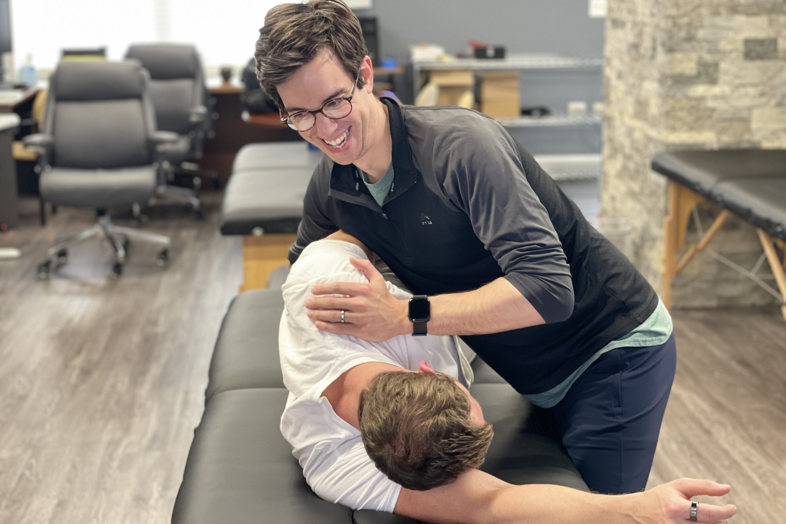 physical therapist practicing new techniques at shoulder CEU course
