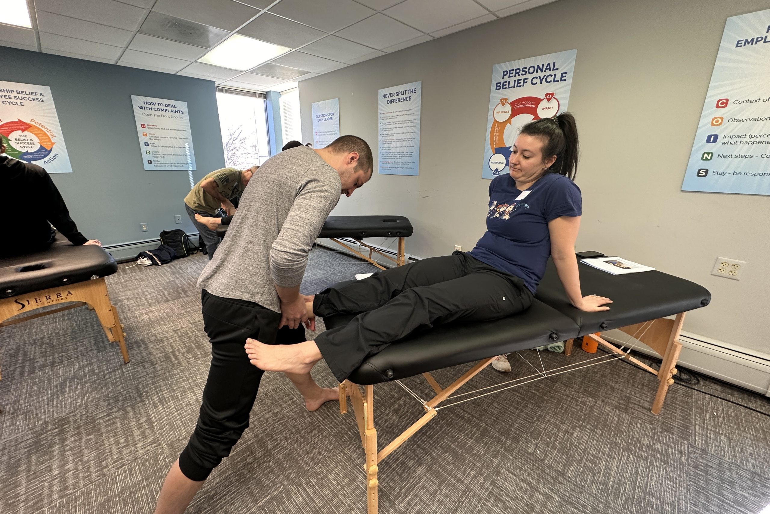 physical therapists practicing new techniques learning at running CEU course