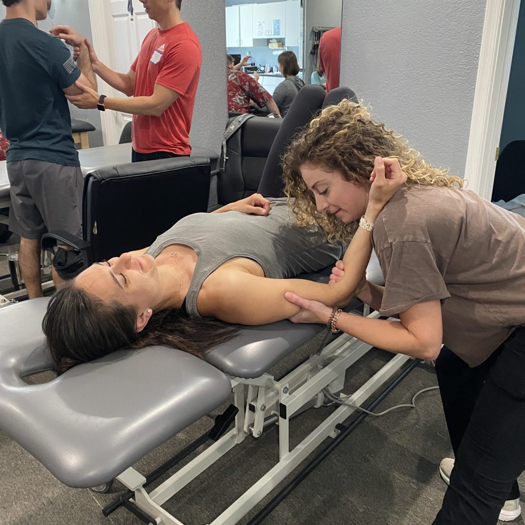 therapists practicing new techniques at CEU course